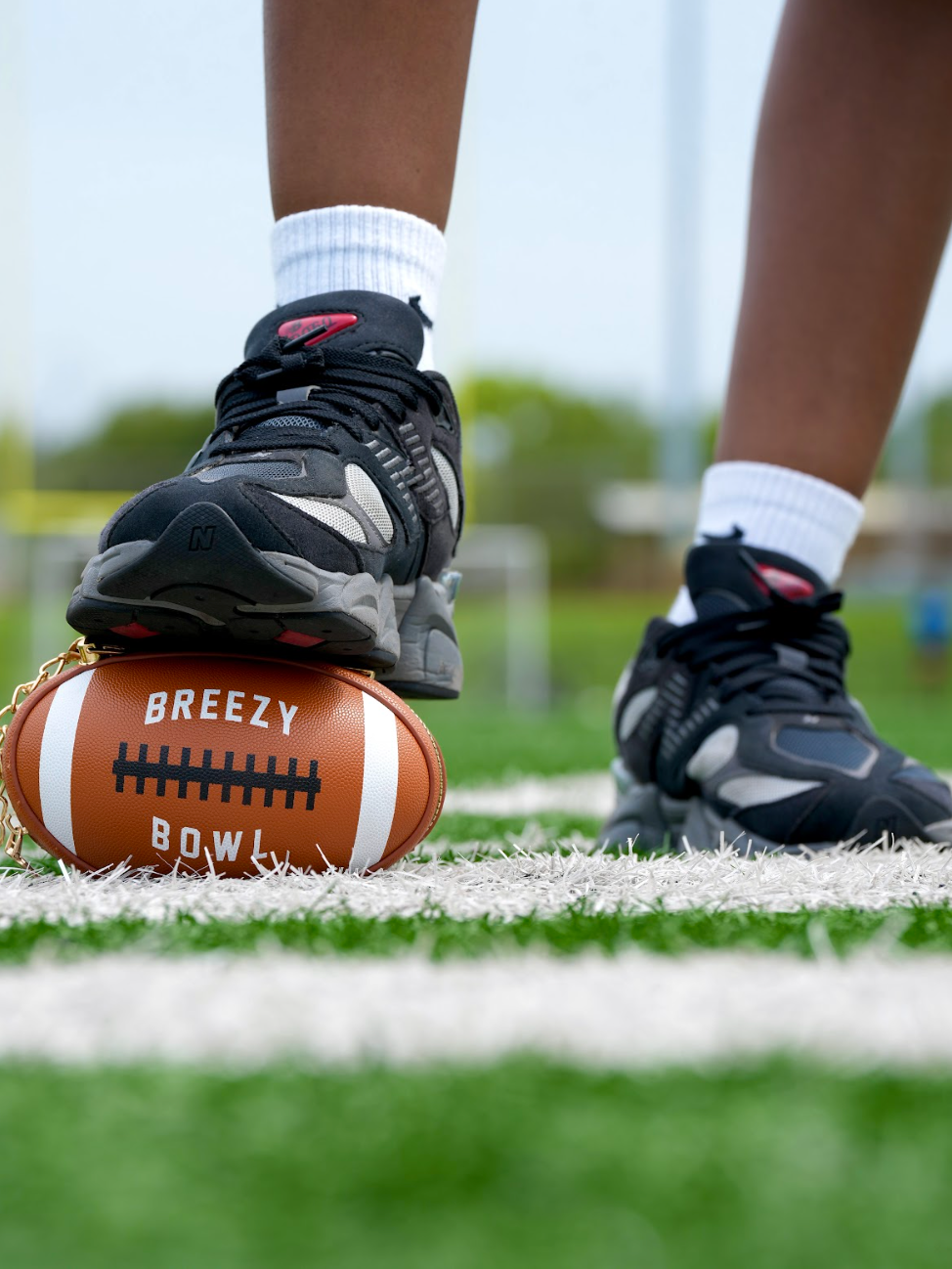 Image of Breezy Football Shaped Clutch Purse