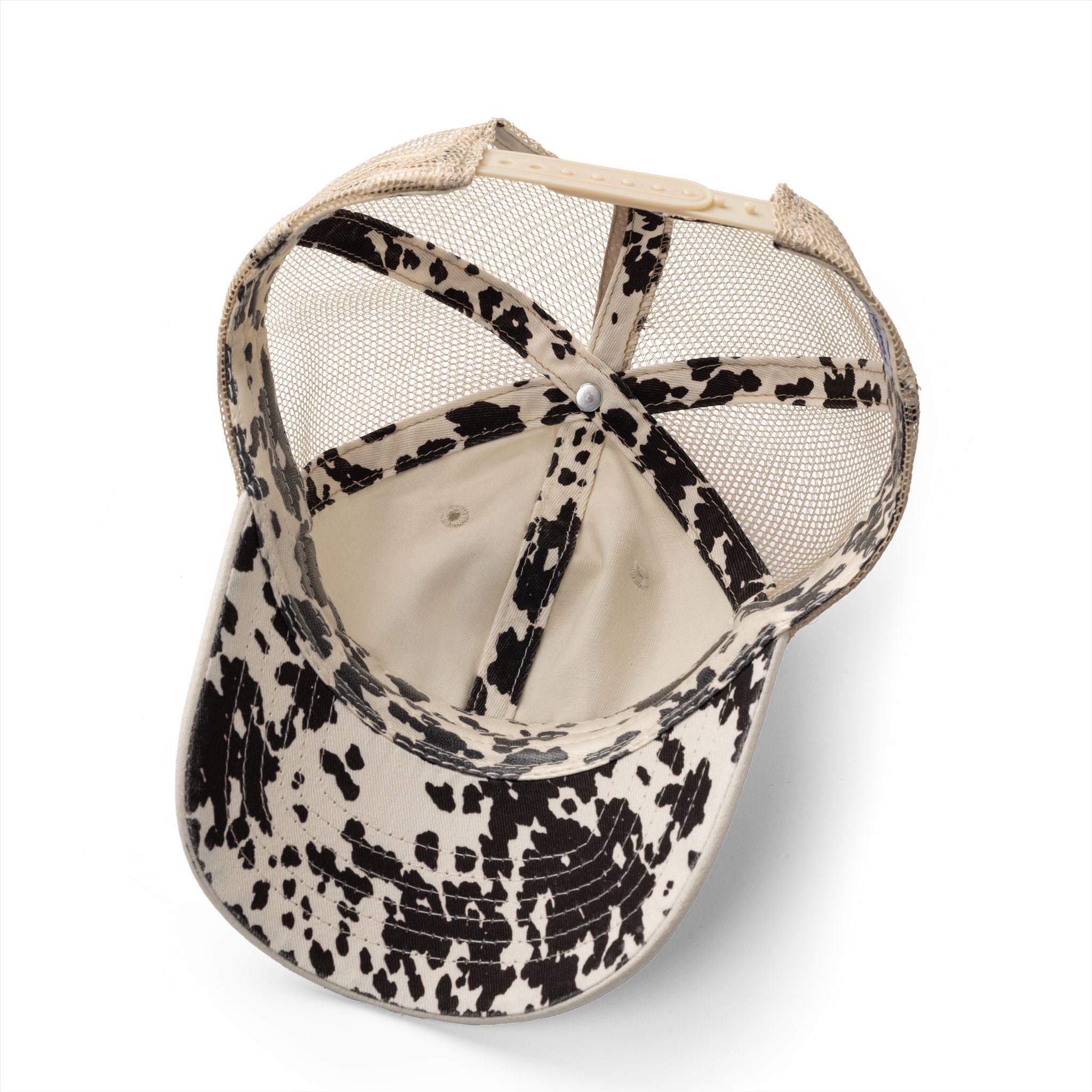 Image of Cow print lining inside coastal cowgirl western trucker hat