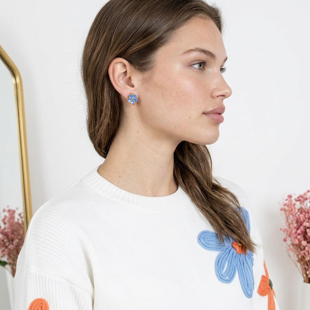 Image of A woman in side profile wearing a flower petal clip on earring