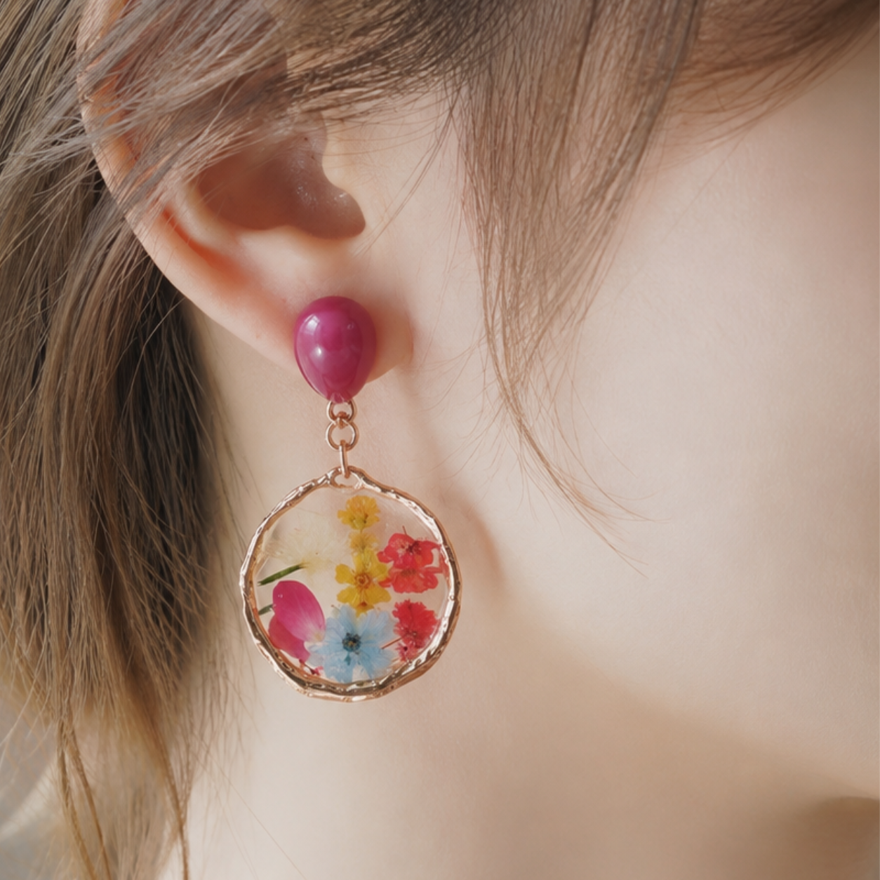 Image of Close up model ear wearing Botanical pressed clip-on earrings