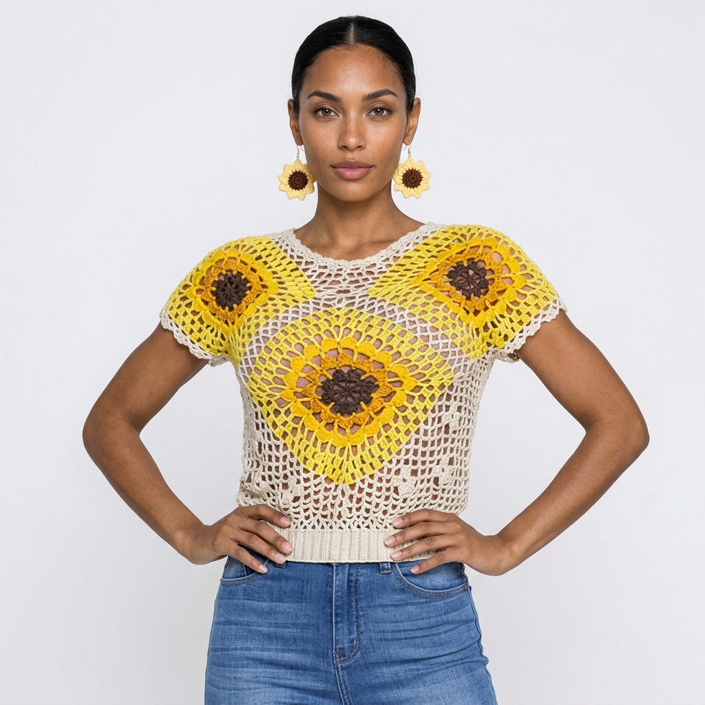 Image of A woman modeling hand-made crochet dangle earrings