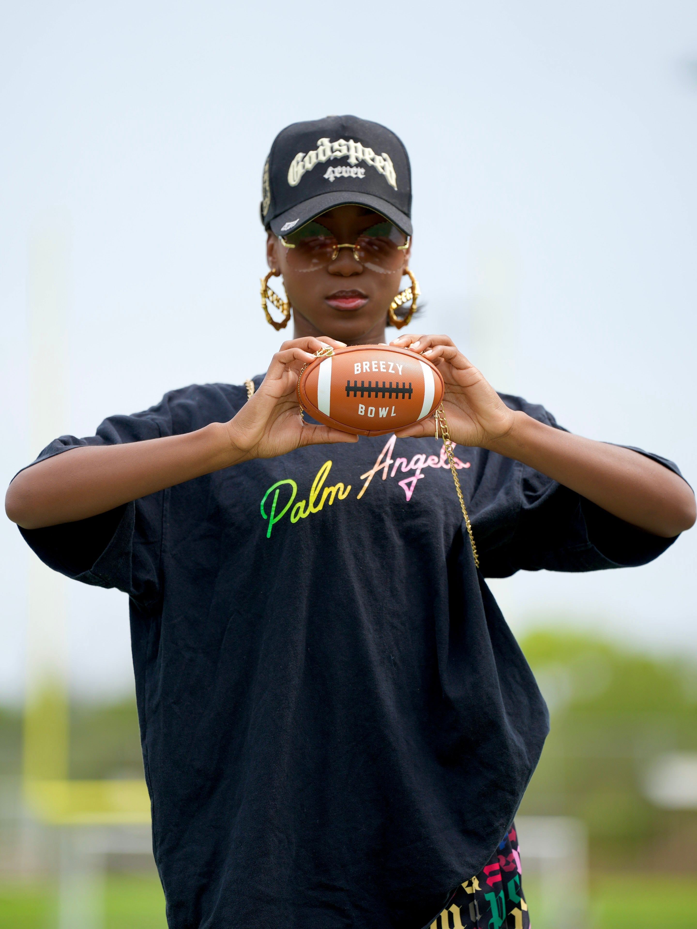 Image of Breezy Football Shaped Clutch Purse