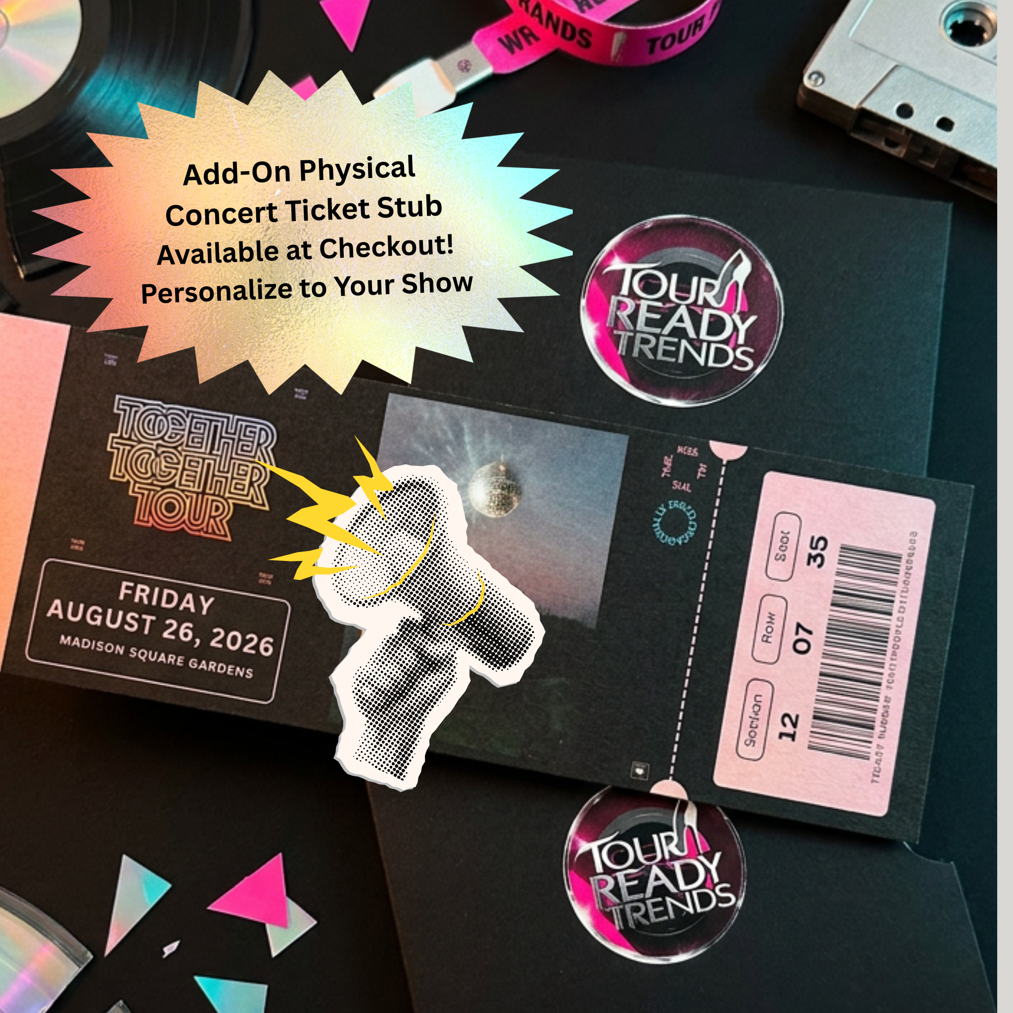 Image of A concert ticket stub product mockup laid flat on a dark surface, featuring a black printed stub with a pink and white Tour Ready Trends logo, a pink ticket label, a torn paper stub overlay, and promotional text reading 'Add-On Physical Concert Ticket Stub Available at Checkout! Personalize to Your Show.'.