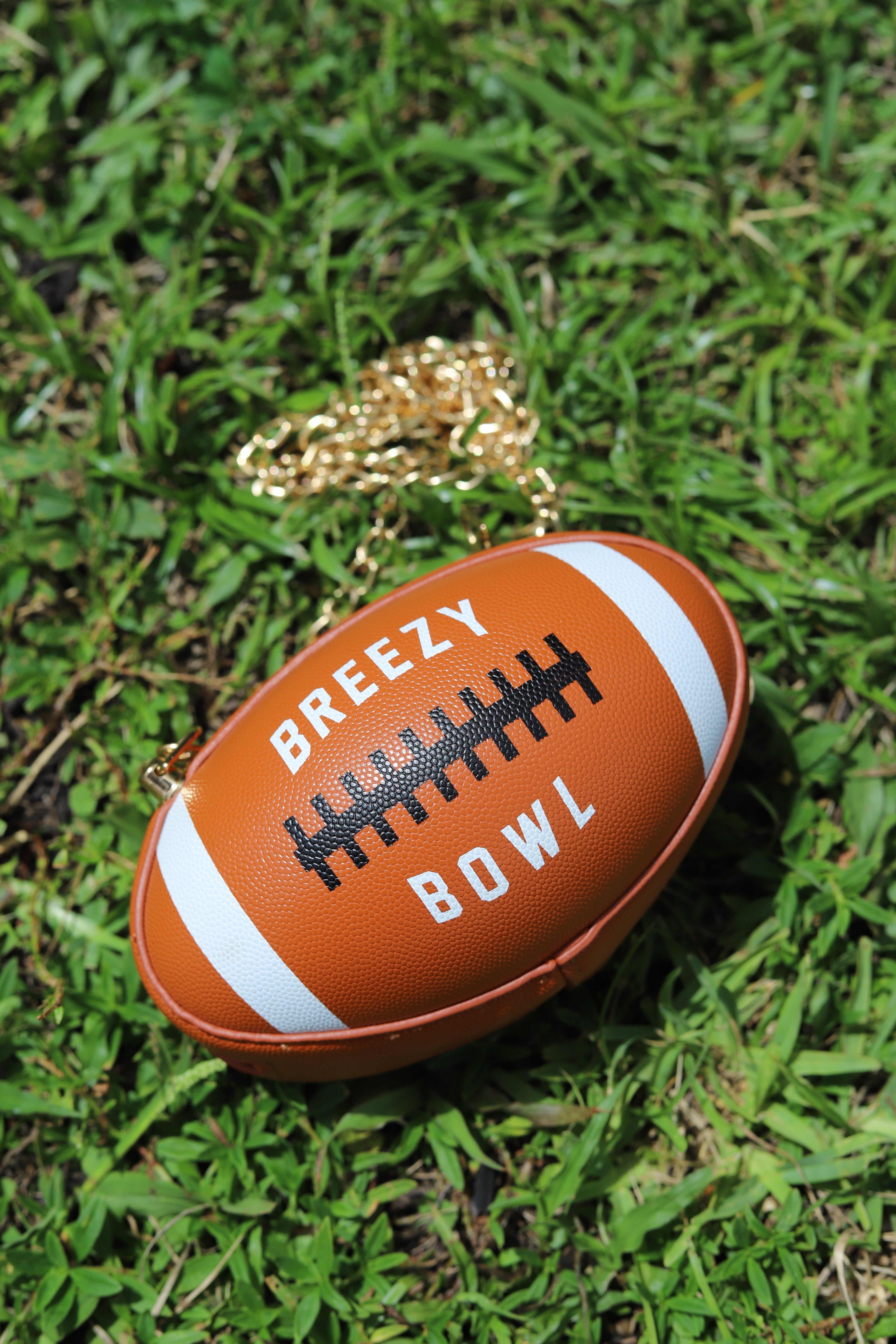 Image of Breezy Football Shaped Clutch Purse