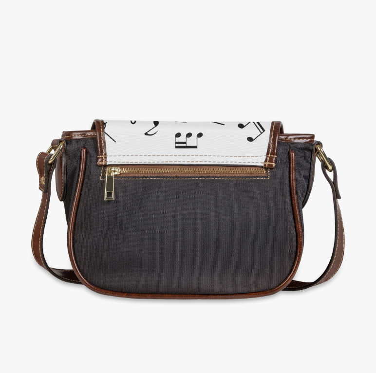 Image of Back view of a music note crossbody bag with a black body and brown vegan leather trim, a gift for Michael Jackson fans and music lovers