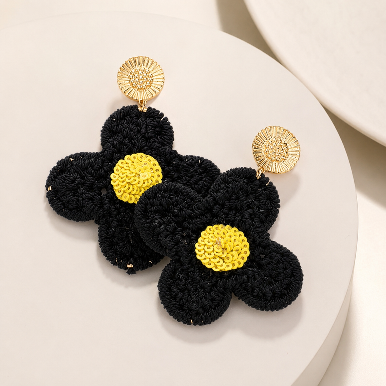 Image of Flat Lay of Crochet Sunflower Earrings