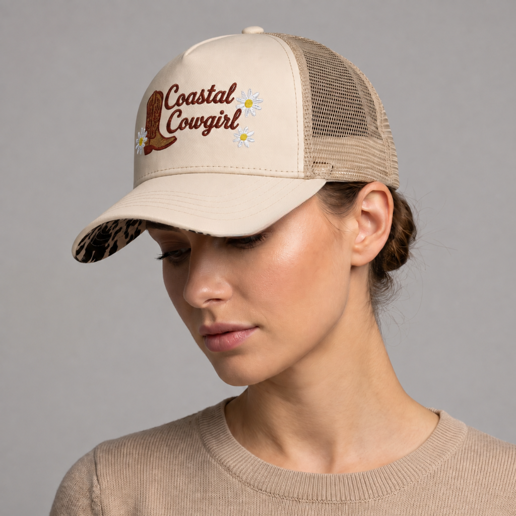 Image of Close-up of vanilla country trucker hat with Coastal Cowgirl daisy embroidery