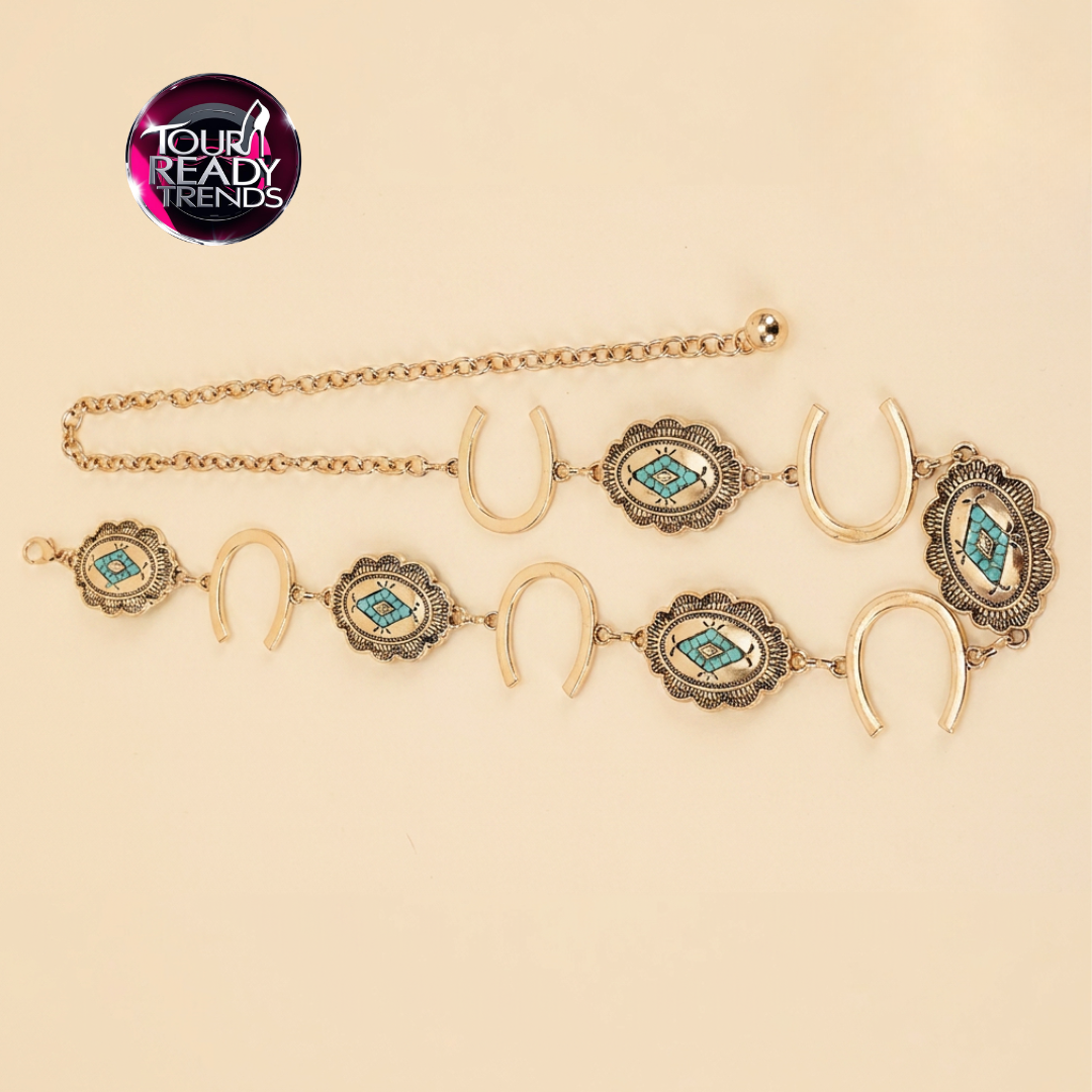 Image of Flat lay of an antique gold cowgirl belt featuring turquoise concho medallions and horseshoe chain links, western jewelry