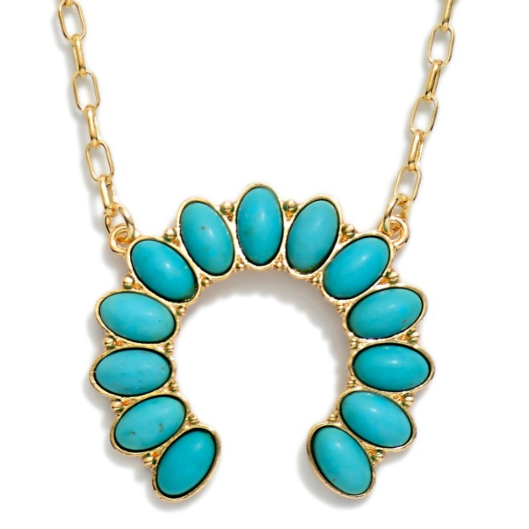 Image of Western Turquoise Necklace with a crescent-shaped pendant featuring ten oval turquoise stones, shown on a white background.